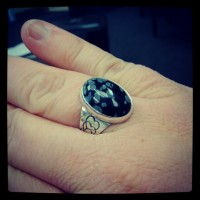 Completed ring with snowflake obsidian stone set into place